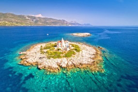 Aerial view of lonely island with lighthouse, Korcula riviera of Croatia, island Vela Sestrica
